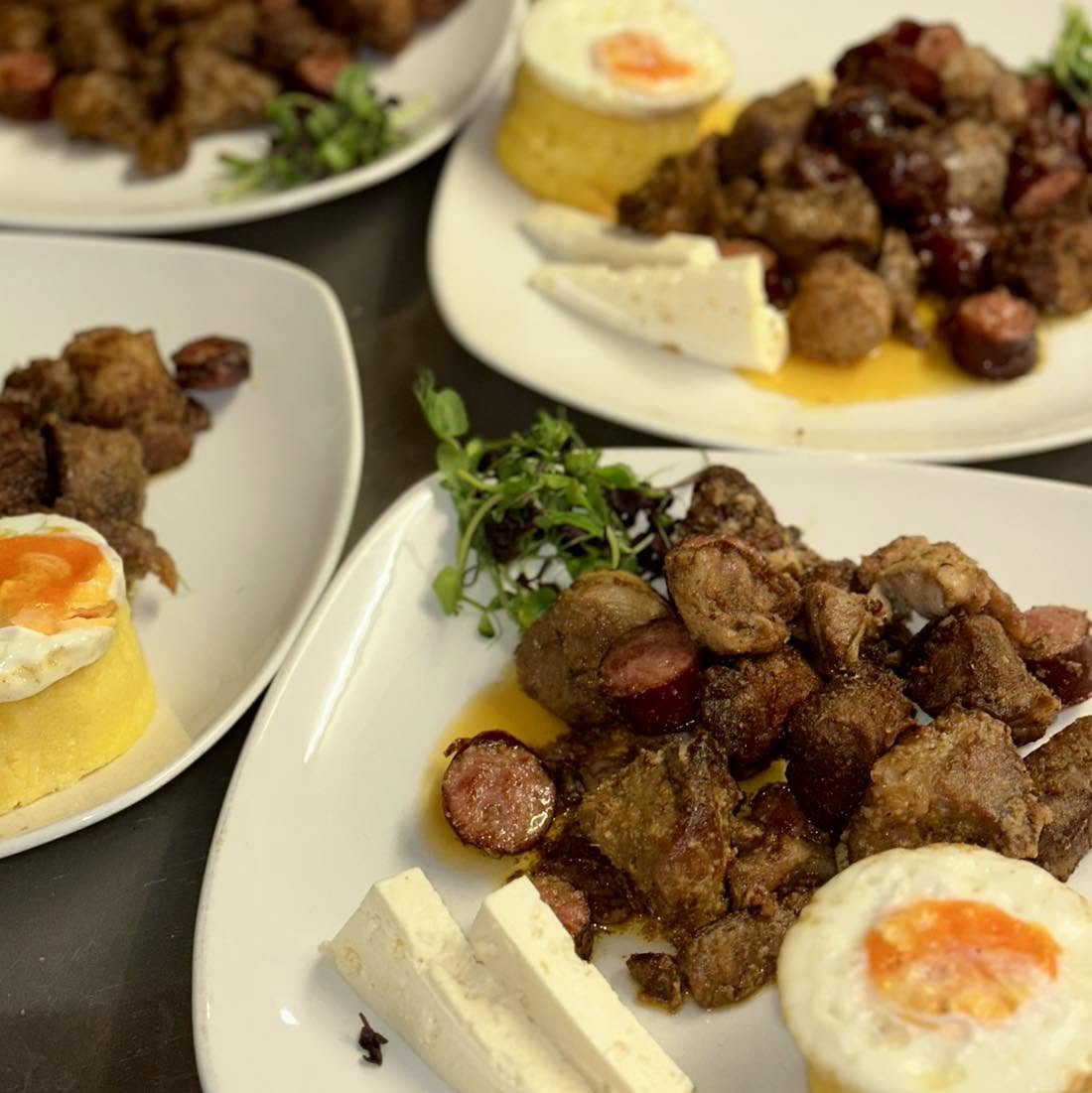 Tochitură · pork and sausage with polenta and egg